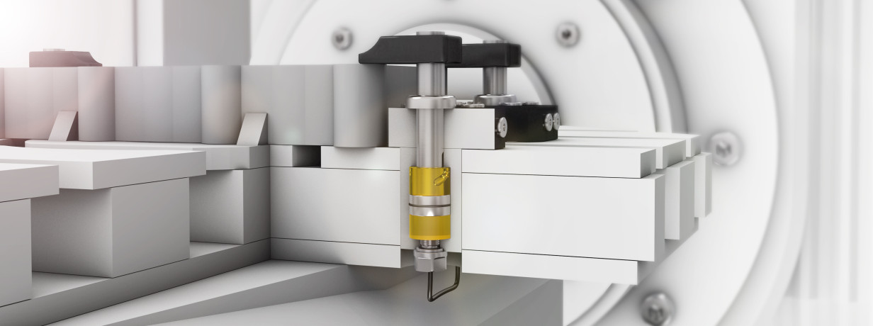 Ultrasonic position sensor directly monitors workpiece clamping